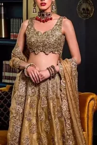 This bridal dress is perfect for your special day. Blouse is beautifully decorated with floral embroidery and embellished scalloped border. It is adorned with kora, dabka, tilla, sequins and pearls. It comes with an exquisite lehengha with thick embroidered border to give it a regal look. Dupatta comprises of floral thread embroidery allured with thick embellished border