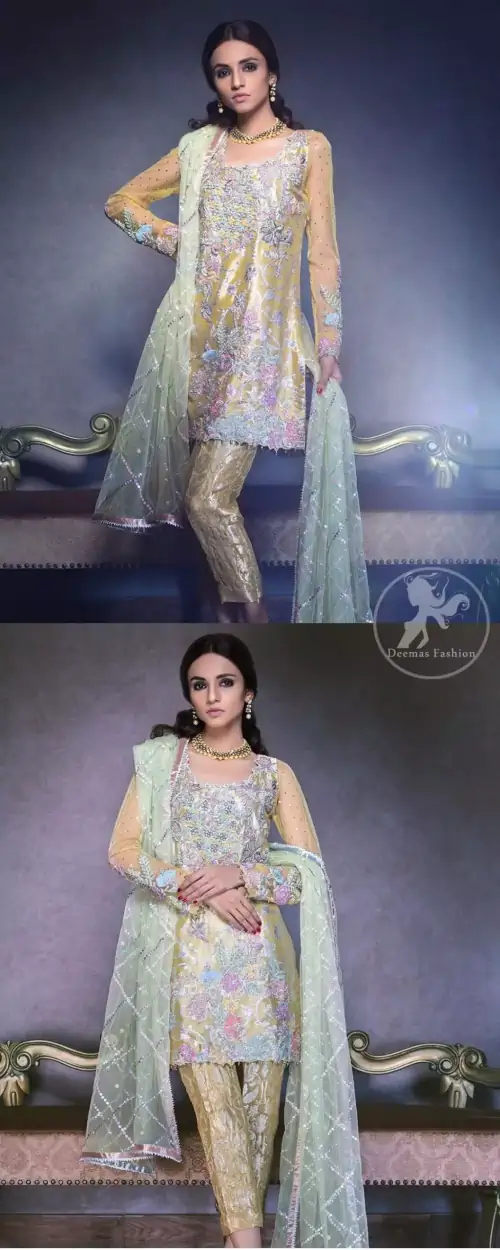 This super stunning  shirt is made of rich floral embroidery which is further enhanced with colorful gota work.  It is