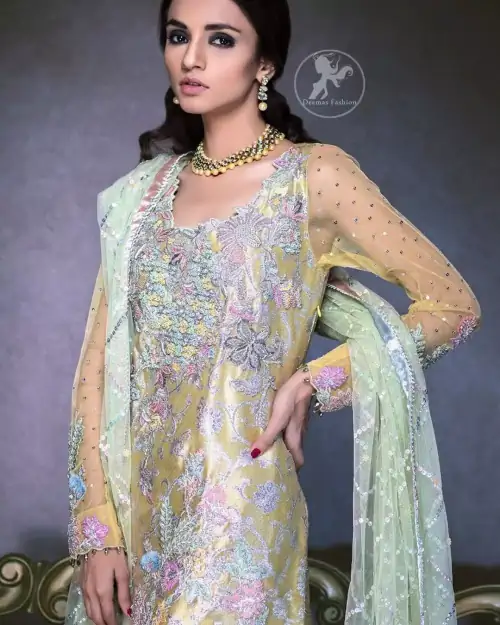 This super stunning  shirt is made of rich floral embroidery which is further enhanced with colorful gota work.  It is