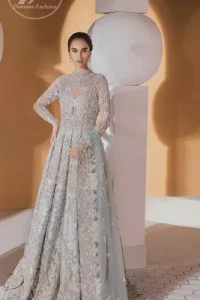 Take a step towards refreshing your wardrobe with this outfit. The frock is perfected with delicate golden and silver embroidery. Furthermore this shirt is made of rich floral embroidery which is enhanced with zardoze work. It is highlighted with kora, dabka, tilla, sequins and pearls. It comes with brocade churidar pajama. It is coordinated with tissue dupatta which is sprinkled with sequins all over it. It is further furnished with four sided matha patti style embellished border.