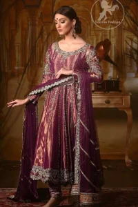 Delicately crafted and personifying chic elegance with an element of grandiose. The detailed kundan work on neckline and vertical panel stripes ornamented with silver and antique shaded kora and dabka embroidery on the neckline, the thick scalloped borders and floral bunches refined the classical look. It comes with beautifull brocade churidar oajama. It is coordinated with organza dupatta which is decorated with gota work on the ground and zardosi work on all four sides of borders.