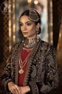 Steal the moment with our rangoon green gown emphasized with traditional and intricate floral embroidery enhanced with antique shaded kora, dabka, tilla and sequins. Perfected with antique gold embellishments this black velvet ensemble is timeless masterpiece in to a chic fantasy. It is fully decorated with antique shaded embroidery and floral motifs all over. Bottom is enhanced with bottle green velvet patch. paired up with floor length dark tan inner. It is coordinated with chiffon dupatta which is sprinkled with sequins all over it.