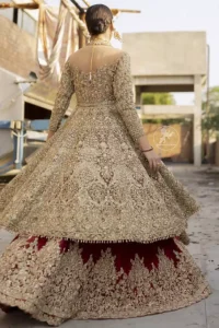 This bridal dress is perfect for your special day. Create a vision of elegance with red wine lehenga decorated with intricate gota detailing and silver gold kora dabka and sequins. Heavy embroidered frock comprises with red wine scalloped border lehenga. The outfit is coordinated with an organza dupatta with hand embroidered borders on all four sides and gota sequin work on the ground.