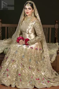 The antique brass lehenga is an example of remarkable handiwork. With a lot of attention to detail, the intricate sequencing, kora, dabka embellishment and multiple color thread embroidery makes this outfit look like nothing but a dream. The floor kissing asymmetrical lehenga add to its charm. Elegance is personified when it gets paired up with beautiful embroidered dupatta with sequins spray all over and embellished scalloped border datailing.