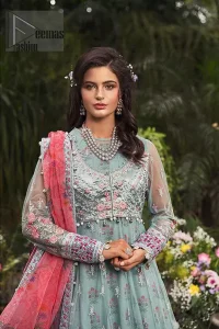 Gussy up in this luxuriously designed pishwas emboldened with intricate embroidery along with beautiful rich patterns and delicate details at the daaman. The front open jacket executing heavily hand crafted art of zardosi, kora and dabka with splashes of silver and pink floral motifs is a classical visit to feminine personification. Having full length sleeves adorned with floral bootis and lace details. It comprises with matching churidar pajama. Style it with self printed net dupatta having four sided thin border and dangling balls on all four sides.