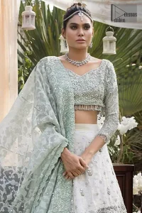 This bridal dress is perfect for your wedding or nikah day. Create a vision of elegance with this ivory self printed lehenga decorated with intricate zardosi detailing and silver kora, dabka and sequins. Furthermore it is adorned with scattered tiny floral motifs. Having quarter sleeves adorned with motifs. Beautifully coordinated with heavy embellished blouse with silver kora, dabka, sequins and pearls all over and finishing with tassels at the end. It comprises with light green self printed dupatta having matha patti border on the front and intricate beautiful border on all rest of the three sides.