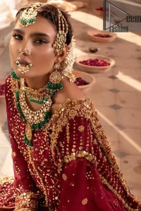A must have creation for your wedding day. This traditional front open style bridal is aesthetically designed with sequins beads details, embellished with kora, dabka, nakshi and sequins. The daaman is emphasized with intricate zardosi details that gives perfect ending to this pishwas. Style it up with artfully coordinated maroon sharara finessed with golden zardosi details at the bottom. The dupatta incorporates beautifully designed borders on all four sides, focusing on the criss cross pattern to give it a perfect look.