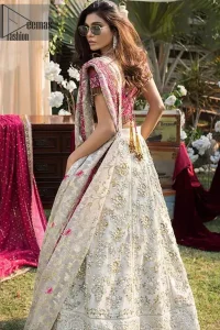 This dress is perfect for Reception or Nikah day. The bridal stands out due to its uniqueness and the perfect fusion of modern cut and traditional embroidery. Make your big day more interesting with this shabby chic statement intensified with rich zardosi work all over the front and bold patterns at daaman. The blouse is fully embellished with champagne and antique shaded embroidery all over and finishing with tassels. The outfit is beautifully coordinated with self printed dupatta adorned with shocking pink embellished applique on all four sides.