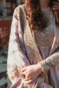 This dress is perfect for your Nikah and Engagement function. This super stunning frock is made of rich floral embroidery and geometric patterns which is further enhanced with gota work. Having full length sleeves adorned with motifs. Multiple color thread embroidery gives it a classical look. It comprises with cigarette pants ornamented with gota work and thread embroidery details. Style it confidently with raw silk fully embroidered dupatta adorned with geometric patterns and also having four sided border.