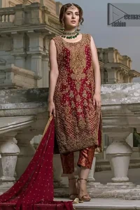 This outfit will make you look like the star of the event. A bold and captivating design with a traditional intricate embroidered neckline and corners at the daaman is perfect for your outings. The bottom of the shirt is also enhanced with criss cross patterns, floral motifs and sequins chann. The back of the shirt has a large central motif and small motifs in kora dabka with sequin spray all over. It comprises with brocade maroon cigarette pants. The outfit is coordinated with crimson dupatta having four sided thin border and sequins spray all over.