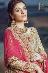 This dress is majestic beauty. A jacquard fabric maxi adorning personification of a majestic look with a contemporary silhouette showcasing the timeless art of zardosi, naqshi, kora, dabka and thread work, having full length scalloped sleeves with ethereally handcrafted golden zardosi work and resham embroidery. The bottom of the maxi is enhanced with rich floral embroidery and motifs pattern. It comprises with matching churidar pajama. The dupatta incorporates beautifully designed borders on all four sides, focusing on the heavily embellished pallu borders to give it a perfect maharani look.