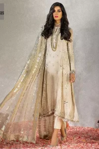 Reflecting royalty and the majestic beauty of statuesque shape and silhouette which makes the dress perfect for nikah day. This regal ivory a-line shirt is an immensely captivating traditional piece. Having full length sleeves adorned with a large floral motif in the center. The daman is furthermore highlighted with matching embellishment that instantly draws attention. It comprises with cigarette pants. Pair it up with self embroidered tissue dupatta.