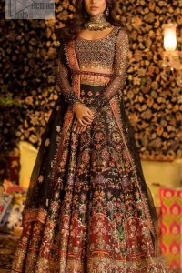 Tradition meets modernity. Go glam in our black traditional lehenga blouse. This outfit bursts of vibrant colors and sumptuous details of zardozi, gota, kora and dabka is a perfect Mehndi ensemble. It is aesthetically designed with thick borders and floral bunches refined the classical royal look. Blouse is decorated with geometric patterns having full sleeves adorned with zardosi work and sprinkled sequins. Style it up with black net dupatta sprinkled with tiny floral motifs and four sided applique embellishment. The piece comes with a handcrafted belt.