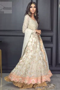 Reflecting exuberant color play in this ethereal piece meticulously highlighted with antique shaded kora, dabka, tilla and sequins. The frock is delicately crafted with floral bunches, fully embellished bodice and scalloped applique daman to give it a perfect ending. The contemporary yet traditional embroidered stripes on the sleeves completes the look. The outfit is comprises with mustard crushed sharara. It is paired with ivory chiffon dupatta with sequins chann all over and two sided embroiderd pallu.