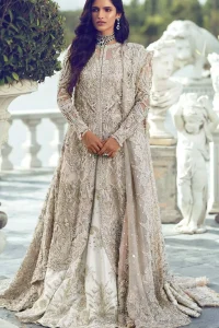 Captured in traditional silhouette, The bridal stands out due to its uniqueness and the perfect fusion of modern cut and traditional embroidery. It is highlighted with silver and light golden kora, dabka, tilla, sequins and pearls. It comes with heavily embellished front open back trail gown ornamented with floral embroidered  motifs and geometric patterns. Paired up with ivory lehenga done with light gold embroidery. It is coordinated with chiffon dupatta which is sprinkled with sequins all over it. It is further furnished with four sided border.