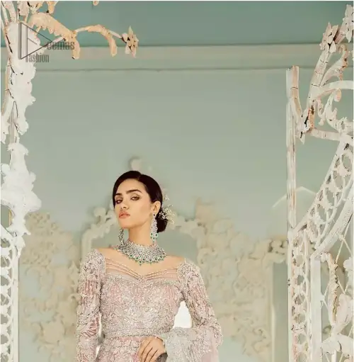 An example of beauty and elegance. Look breathtakingly stylish in this embroidered regalia furnished with intricate embroidered neckline. This ethereal