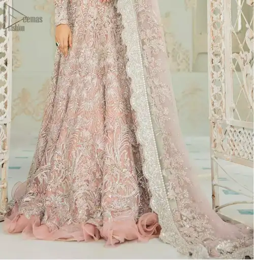 An example of beauty and elegance. Look breathtakingly stylish in this embroidered regalia furnished with intricate embroidered neckline. This ethereal