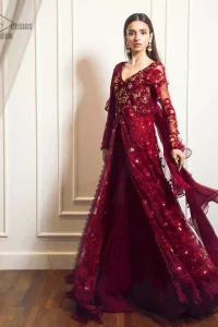 This exceptionally detailed front open gown lehenga is cut in a seductive fit and flare silhouette that’s sure to turn heads on your big day. The bodice with plunging V-neckline is adorned in richly floral lace with fabulous sparkle. Furthermore the bodice is highlighted with golden zardozi work and floral applique. Center slits and bottom of the gown is beautifully decorated with floral lace. It is coordinated with maroon crushed lehenga and organza dupatta. 