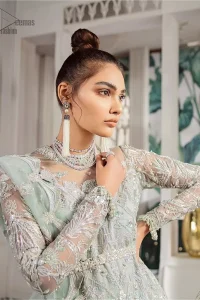 Delicately crafted and personifying chic elegance with an element of grandiose. This outfit is aesthetically designed with motifs and floral patterns, embellished with kora, dabka, nakshi, sequins, cutdana and  crystals. The detailed scalp border gives a perfect ending to this peplum. Beautifully designed sleeves is an amalgamation of floral design elements. Sharara comprises of sequins spray all over. The dupatta incorporates beautifully designed scalloped borders on all four sides and tiny floral motifs.