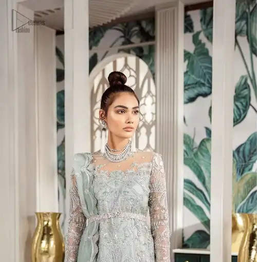 Delicately crafted and personifying chic elegance with an element of grandiose. This outfit is aesthetically designed with motifs and floral