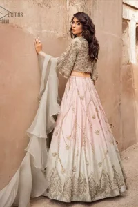 This artisanal piece is rendered in grace and timelessness. An example of beauty and elegance. Look breathtakingly stylish in this embroidered regalia furnished with intricate embroidered blouse and scalp third quarter bell sleeves. It comprises with gradient lehenga having light pink and mint green colors done with zardozi floral bootis and a thick embellished bottom. Style it up with mint green organza dupatta.