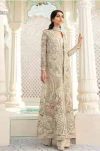 An example of beauty and elegance. A perfect ensemble for this festive season with divine detailing of thread embroidery, color balance and well-crafted scalloped bottom. The front open gown is sculptured with light golden zardozi work all over and multiple color thread embroidered floral. Complete the look with inner jumpsuit style it up with a fixed waist belt. Paired it up with organza dupatta adorned with scattered floral motifs.