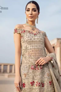Classic and elegant, this dress is perfect for brides looking for a traditionally wedding outfit.. A perfectly pretty combination of light golden and antique embellishment, This off shoulder wedding dress is elegant and eye-catching in equal measure. This off shoulder shirt is done with zarozi detailing and vibrant floral motifs all over. Furthermore it is sculptured with different motifs like birds. It comprises with traditional handcrafted gharara. Complete the look with off white organza dupatta having four sided heavily embellished border and tassels.