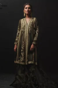Discover your inner charm with this ravishing front open shirt adorned with golden embellishment. A delicate arrangement of hand embellished floral bunches with zardozi work. Full sleeves and side slits are also decorated with kora, dabka, tilla and sequins work all over. It is coordinated with frilled sharara gives it a perfect look. Style it up with olive green dupatta sprinkled with sequins.
