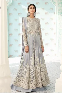 You are all set to make a lasting impact with the divine royalty of this dress. This artisan piece includes intricate hand-embellishment. This technique gives this garments a unique look, and helps to sustain a traditional craft carried out by skilled artisans. This multiple panels front open maxi is ornamented by light gold zardozi work with beautiful embellished motifs around the hem and vertically worked gold lines. It comprises with raw silk sharara adorned with tiny floral motifs and dupatta is decorated with sequins spray all over.