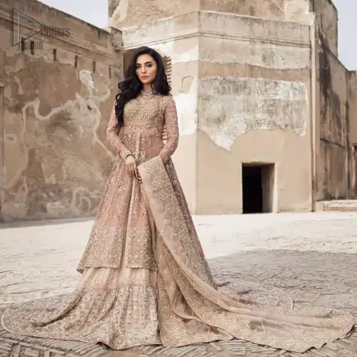 This garnet ensemble is sure to make you look like glamorous royalty with immaculate work covering every inch of the