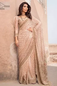 Steal the show with this endearing chiffon saree with intricate yet rich mukesh details. Crafted artfully with detailed thread embroidery on saree pallu and traditional neckline finessed with kora, dabka and kundan. Having full sleeves with mukesh details and zardosi finishing. Furthermore it is adorned from all sides with antique shaded kora, dabka, tilla and sequins.
