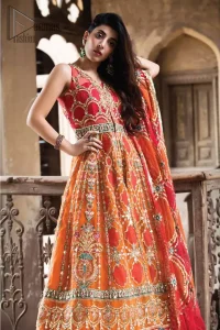 This artisanal piece is rendered in grace and timelessness. Brighten up your look with this mix of floral and geometrical embroidery in vibrant tones spread across on red and orange canvas. The front open pishwas is delicately crafted with zardozi work, multiple color embroidery and mirror work. Furthermore it is also adorned with green embellished applique and the colorful applique lift the whole bottom. It comprises with orange sharara. Finished the dress with red and orange organza dupatta with geometric patterns on the ground.
