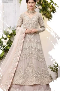 Make a special day even more magic with our exquisite flora bridal maxi dress. Discover classic look in this outfit for a traditional style, with delicate detailing and intricate accents for a subtle yet sophisticated look, having full sleeves with zardozi details. Furthermore the hemline is emphasized with a large central motif and small motifs around it that gives perfect ending to the outfit. It comes with tea pink lehenga with zardozi details on the bottom. Paired with light purple net dupatta sprinkled with sequins and four sided embellished border that gives the right amount of glamour to the outfit.