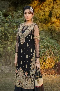 This elegant ensemble turns timeless piece into a chic fantasy. Steal the show with this endearing chiffon outfit with intricate yet rich embroidery. Artfully crafted neckline with detailed golden zardozi work. The hemline is ornamented with a central large motif and adorned with jaal. Furthermore, side slits are also decorated with floral embroidery and floral motifs are decorated with multiple color thread embroidery. The back is perfectly loaded with zardozi work. This outfit is comprises with black sharara and chiffon dupatta having sequins spray all over.