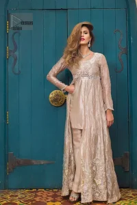 This dress is majestic beauty. Delicately crafted and personifying chic elegance with an element of grandiose. The gown is beautifully decorated with floral bunches done with silver kora, dabka, tilla and sequins work. The bottom of the gown is enhanced with rich floral embroidery. Style it up with hand embellished fixed waist belt. It comprises with cameo straight pantsa. This outfit is coordinated with chiffon dupatta having sequins spray all over.