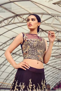 Captured in traditional silhouette, The bridal stands out due to its uniqueness and the perfect fusion of modern cut and traditional embroidery. This dress is beautifully decorated with heavy embroidery. It is highlighted with light golden kora, dabka, tilla, sequins and pearls. Blouse is fully enhanced with zardosi work and multiple color embroidery. It comes with full embellished lehenga adorned with floral booties and heavy embellished bottom. It is coordinated with plum organza dupatta which is sprinkled with sequins all over it.