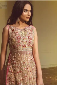 Steal the show with this endearing chiffon outfit with intricate yet rich embroidery. Crafted artfully with detailed multiple color thread embroidery on the bodice and traditional finessed work with kora, dabka, tilla and sequins. Hemline is intricately done with cut work and dangling balls, rest of the shirt is enhanced with floral bunches. Pair it up with fawn lehenga emphasized with different sized circular embroidered motifs at the bottom done with zardozi work to gave it a perfect look. Pair it up with fawn dupatta having four sided embellished borders and sprinkled with sequins all over the ground.