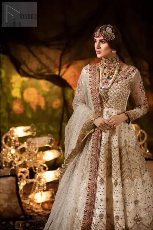 Delicately crafted and personifying chic elegance with an element of grandiose. This outfit is beautifully sculptured with geometric embroidery, adorned