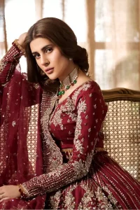 Make your big day more beautiful with our excessively embroidered lehenga blouse featuring delicately embellished back train along with scalloped finishing highlighted with antique embroidered detailing and intricately frilled inner that gives perfect ending to this outfit. The blouse is delicately crafted with antique zardosi work having full sleeves with dangling finishing. It is paired with an ethereal bridal dupatta focusing on kora and dabka handwork borders on all four sides, finished with scalloped borders. With a flowing trail, this is an ensemble that deserves to be flaunted.