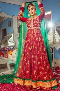 Make a special day even more magic with our exquisite front open bridal maxi dress. This artisan piece includes intricate hand-embellishment. This highly skilled technique involves hand needle work to add beads and sequins to the fabric, giving this garment a unique look. The bodice is delicately crafted with golden zardozi work and multiple color applique with beautiful embellishment. Rest of the dress is adorned with scattered motifs all over. It comes with red brocade sharara. The look is completed with green chiffon dupatta finishing with four sided kiran lace.