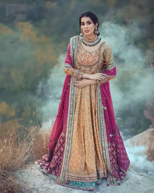 This exceptionally detailed anarkali frock is cut in a seductive fit and flare silhouette that’s sure to turn heads. The