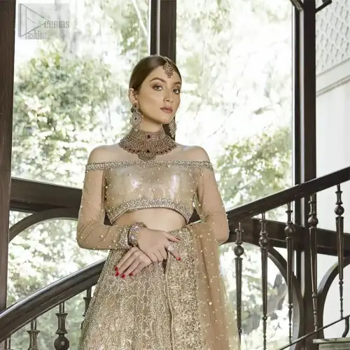 This outfit brings drama and playfulness to traditional lehenga blouse with a modern approach. Classic balanced pattern on the lehenga