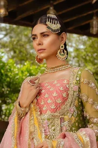 We have brought a charismatic charm to the traditional motifs and cuts. Our embroidery is rich in detailed traditional techniques executed to perfection. The bride shines bright in this outfit, embedded with sophisticated zardozi and thread embeishments. The bodice and hemline is furthermore emphasized with intricate details that gives the perfect ending to this mehndi dress. Pair it up with yellow sharara with captivating embellished border. The dupatta incorporates beautifully designed borders with zardozi, applique and kiran along the length, focusing on the geometrically embellished pallu and sequins spray all over to give it a perfect look.