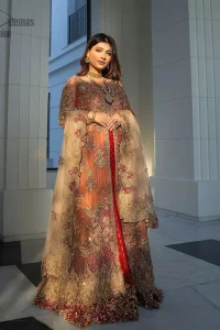 Details make perfection and perfection is not a detail”-DaVinci. This beautiful quote embodies what the DeemasFashion tries to achieve in its every ensemble which is customised to perfection. This beautiful play of red and orange  makes for a stunning. The upper layer of maxi is beautifully crafted with multiple color zardozi work and embroidered jaal. The bottom of inner are even more enhanced with golden zardozi embellishment and finished with scallops. It comprises with churidar pajama and fawn chiffon dupatta. The embellished alluring cut work floral border gives the perfect ending to veil or dupatta.