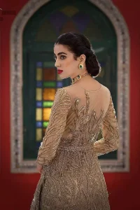 Elevate your style this season with our fashion-forward designs. An artistic vision of classic style and luxurious detailing, transpire into a truly romantic and iconic bridal for your big day. An eye captivating front open long silhouette is fully decorated with antique embellishments all over. Furthermore, it is emphasized with an embellished waist belt and scalloped borders. Pair it up with capri pants and a net dupatta scattered with sequins all over.