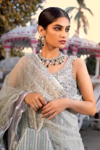 Light gray pure banarsi jamawar blouse, lehenga with front open long jacket having multiple layered frill.