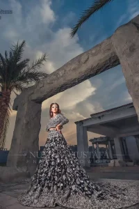 Crafted with love. This outfit is classically designed to make your memorable day beautiful as it should be. Unique craftsmanship and detailed embellishments bring heavenly hued gossamer fabrics to life, creating delicate yet flamboyant pieces of art in our bridal collection. The lehenga is decorated with floral bootis and finished with a heavy thick border with silver zardozi work. Furthermore, the lehenga is also adorned with sprinkled sequins all over it. Complete the look with a navy blue dupatta with tiny floral motifs scattered all over the ground and a four-sided embellished border. 