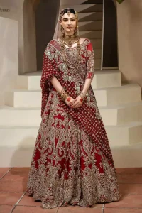 Crafted with love. This dress is classically designed to make your memorable day beautiful as it should be. This handcrafted remarkable ensemble reflects the aura of the heavenly blouse and includes art deco design elements. A wedding ensemble from the house of DeemasFashion in which the intricate detailing makes all the difference. A delicate arrangement of hand-embellished floral patterns with zardozi work makes the skirt more attractive. Complete the look with a maroon organza dupatta adorned with four-sided embellished borders and tiny floral motifs scattered all over the ground.