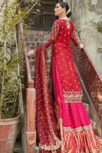 It’s ALL in the details, This breathtaking wedding dress offers comfort without compromising on style. This outfit laden with ornamental embellishments and embroidery creates such a fairytale touch to your big day. Paired with a pink sharara creates an unusual charisma wholeheartedly. Embroidery is done in the shade of golden and tiny floral motifs scattered all over the shirt. Sharara is emphasized with sequins spray and zardozi details at the bottom. Complete the look with a red dupatta having scalloped borders and scattered tiny floral motifs all over the ground.