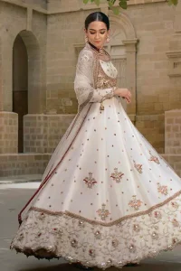 Exceptionally styled and symphonized stitching makes you gorgeous enough that it would surely make your big days remembering one. The Ivory Pishwas Frock is a true beauty when it comes to the work of perfection. Latest Nikah Dress - Ivory Pishwas Frock n Dupatta.